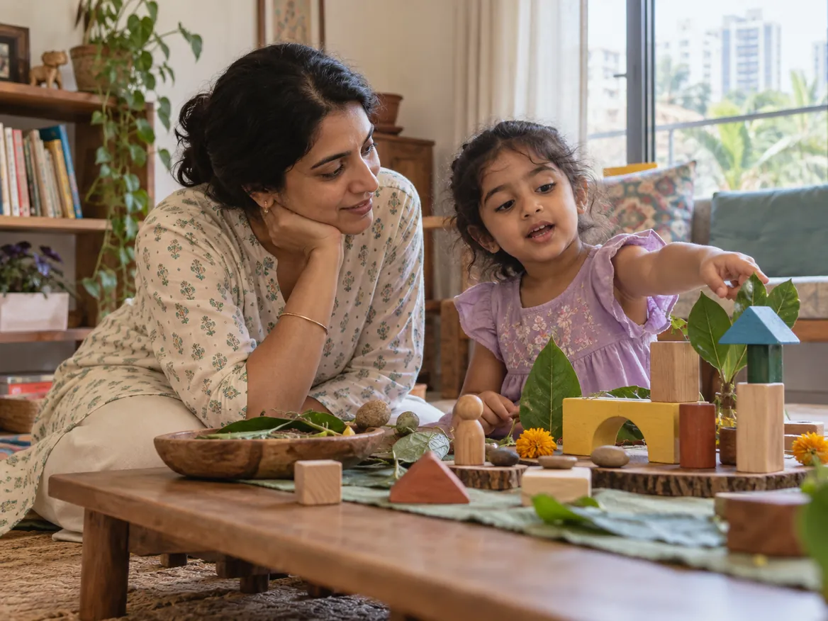 A parent listening while a child points to a block building at home